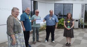 Photo taken on 2nd September 2022 where President Jamie presents the cheque of £1000 to Macmillan Cancer Support. 